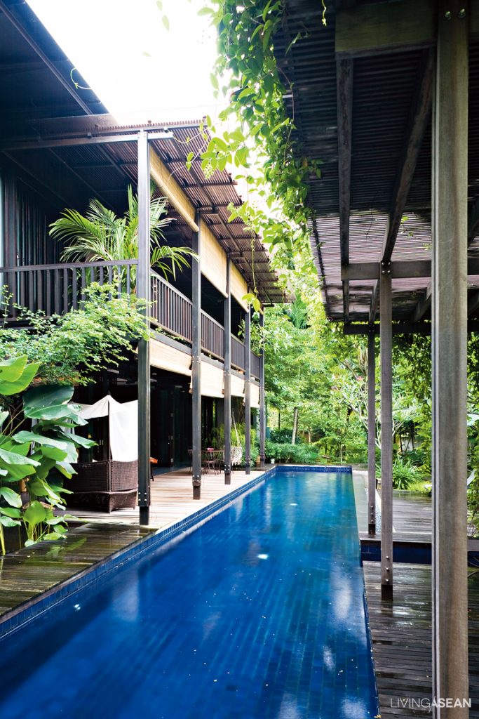 nestled in a residential neighborhood near singapores downtown the house stands hidden in plain sight behind a row of leafy trees - Modern Tropical House Design nestled in a residential neighborhood near singapores downtown the house stands hidden in plain sight behind a row of leafy trees - Modern Tropical House Design